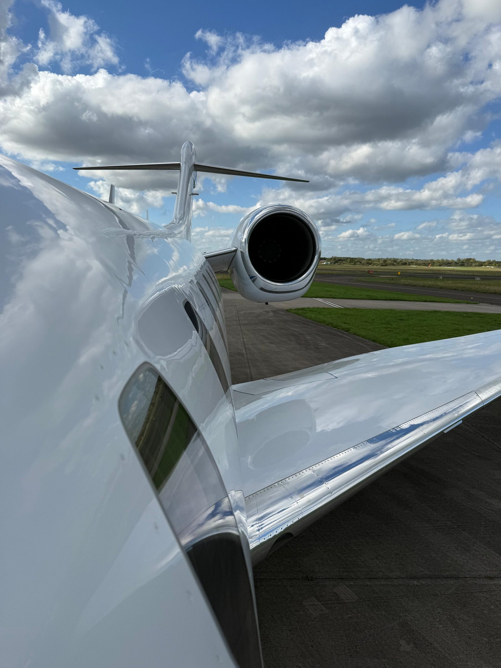 Close view along the wing of the Citation X toward the engine and tailplane